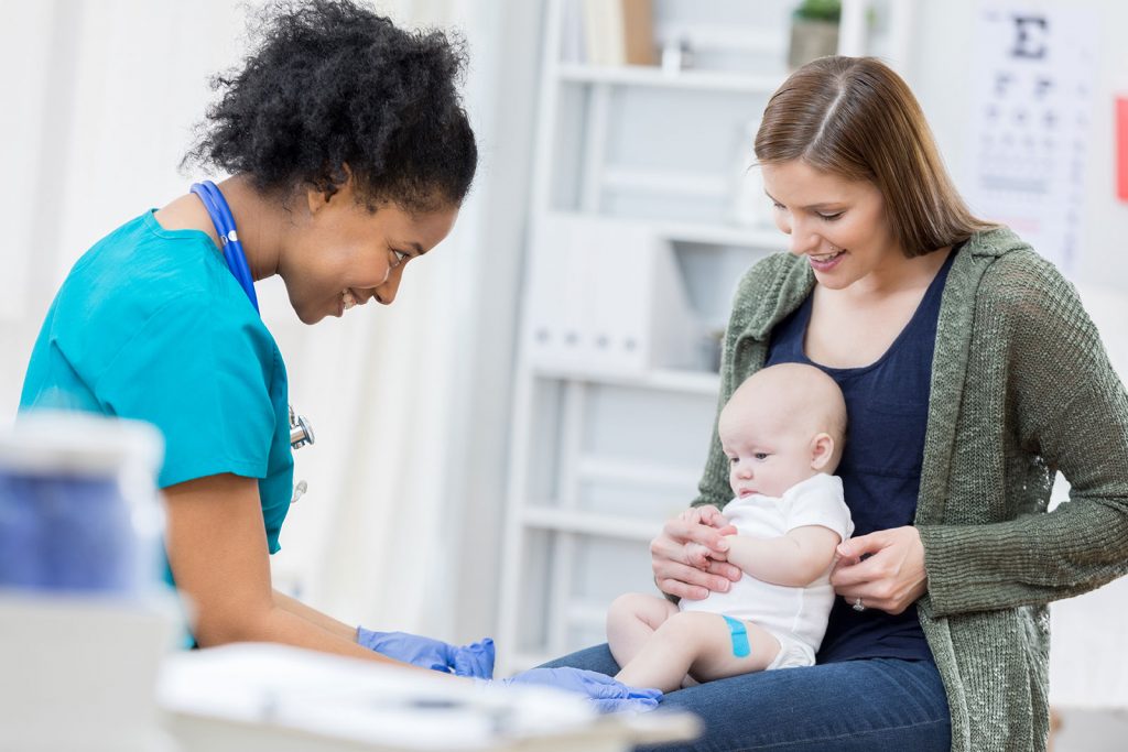 Nurse, baby and mother