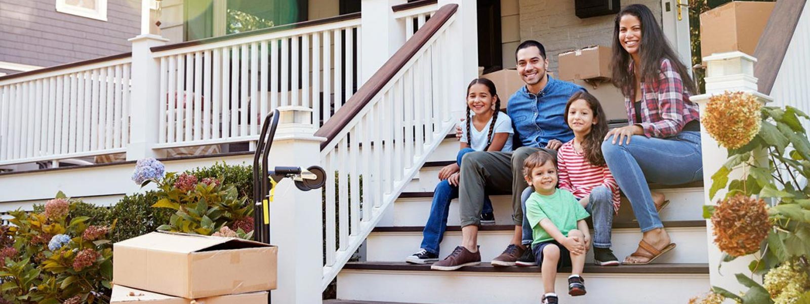 Family sits on porch steps