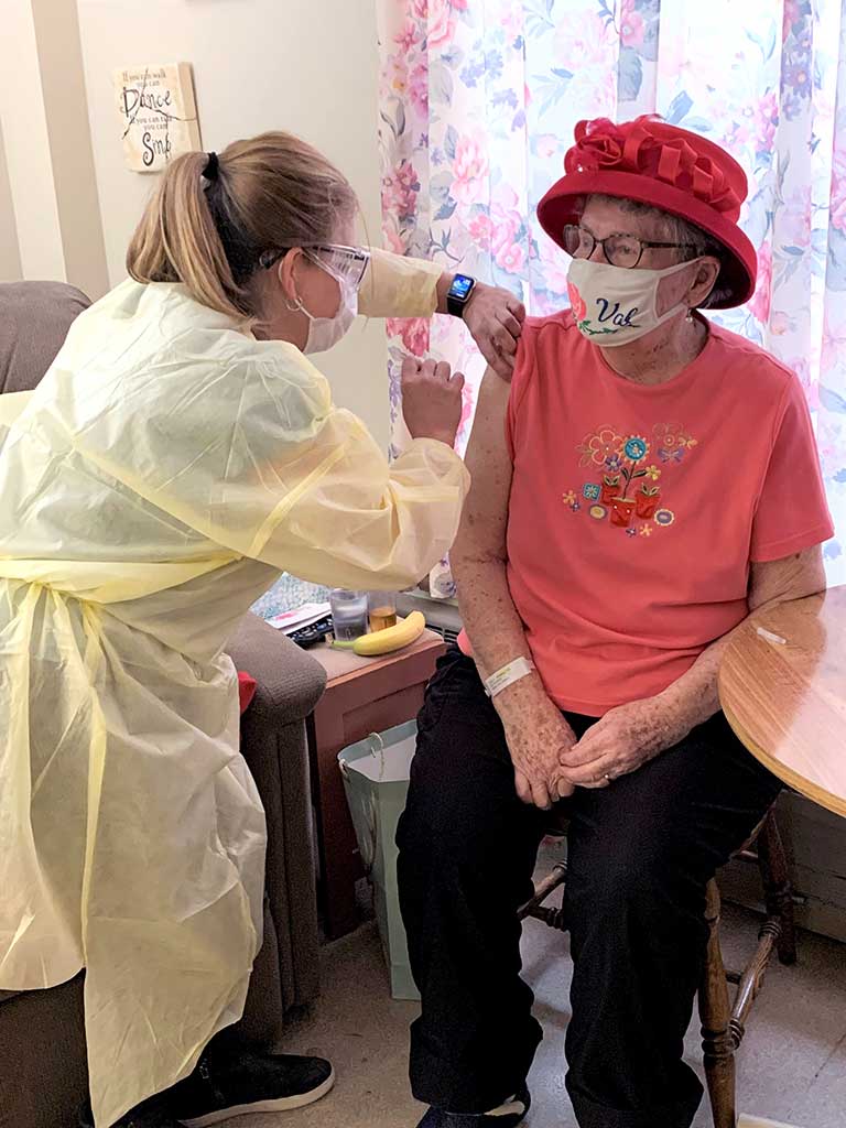 Valerie Verberg receiving the first COVID-19 vaccine in Lambton County.