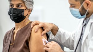 A woman receives the COVID-19 vaccination.