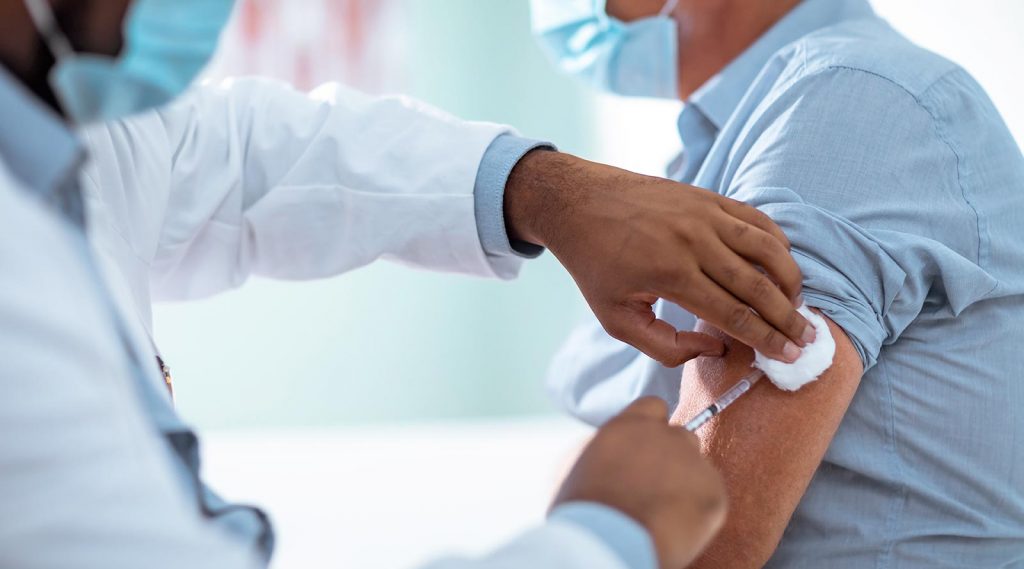 A man receives a COVID-19 vaccination.