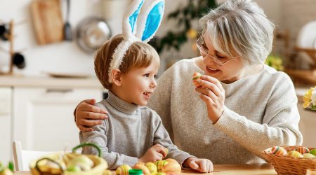 A grandmother and child with Easter eggs.