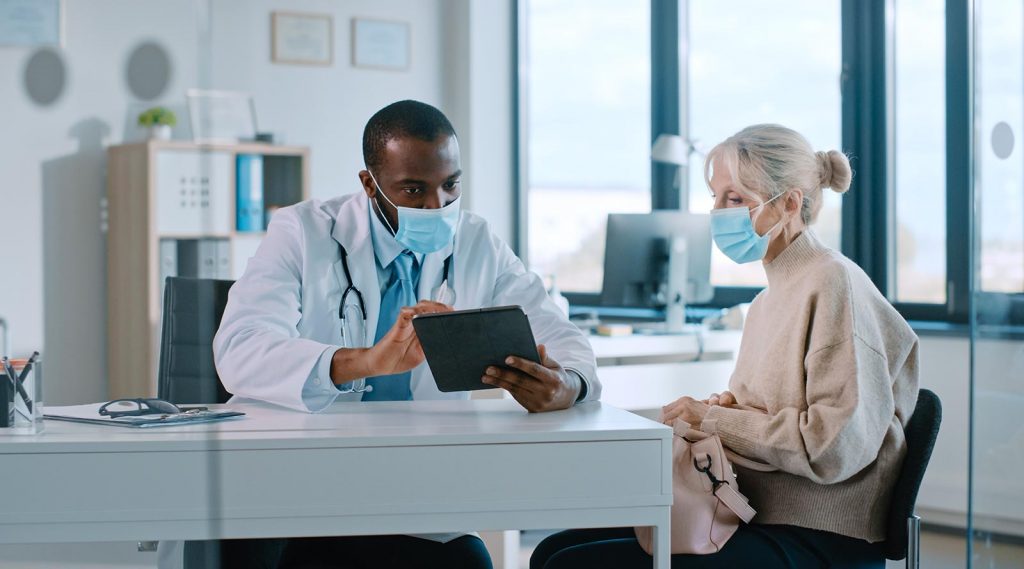 A doctor having a discussion with a patient.