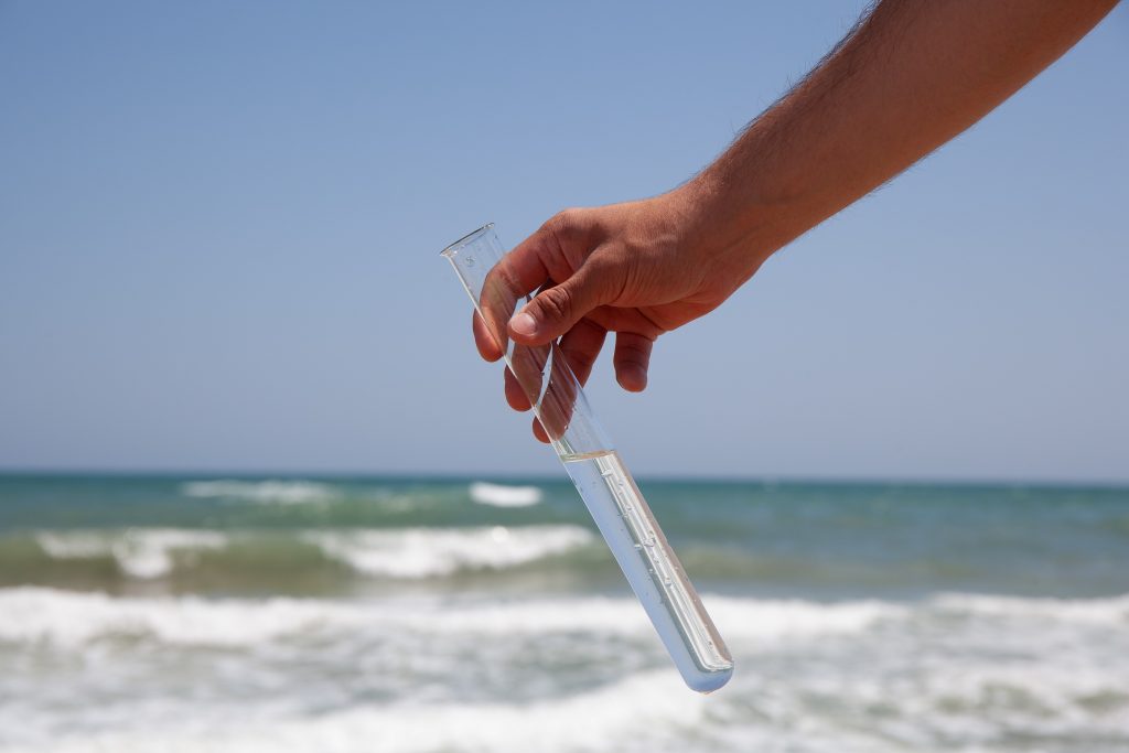 Beach water sample in a test tube.