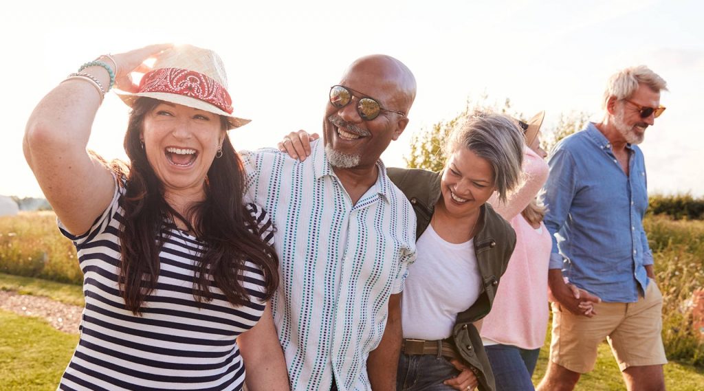 A group of friends and couples walking outdoors.