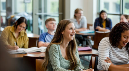 Students take notes during lecture for reference later.